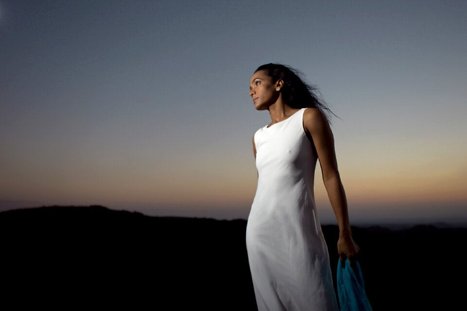 Beautiful young woman wearing elegant white dress