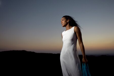 Beautiful young woman wearing elegant white dress photo