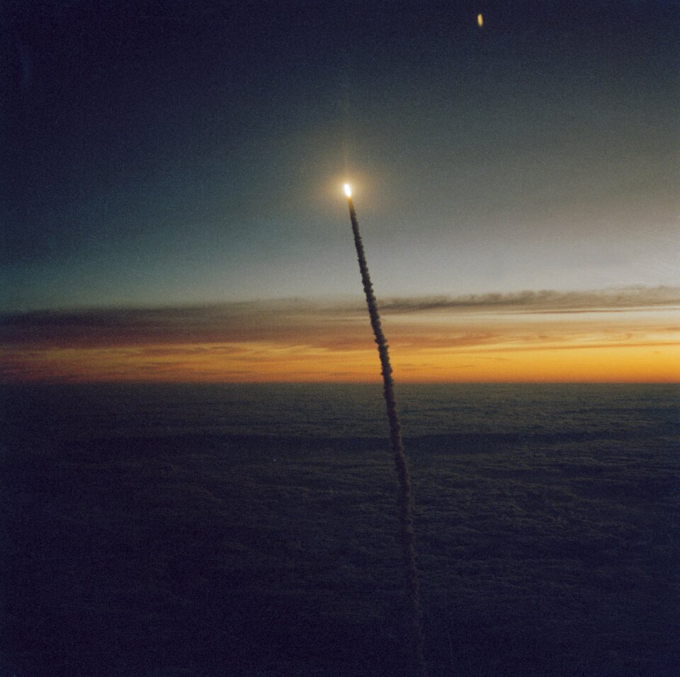The Space Shuttle Challenger launches from Florida at dawn