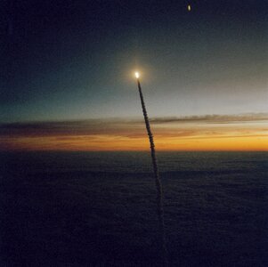 The Space Shuttle Challenger launches from Florida at dawn