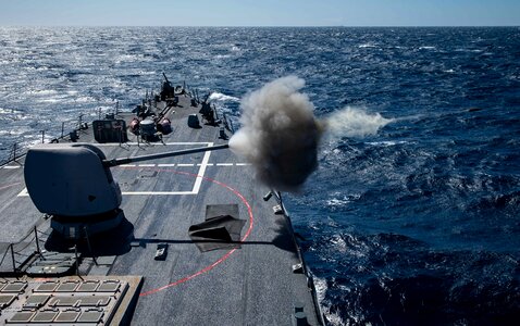 USS Porte fires a Mark 45 5-inch gun