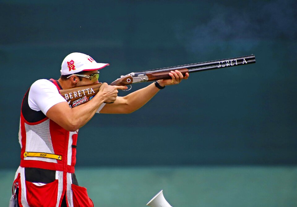 Man shooting skeet with a shotgun