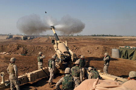 An M-198 155mm Howitzer of the US Marines firing photo