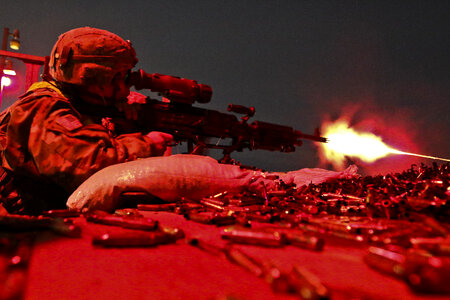 U.S soldier fires an M240B machine gun photo