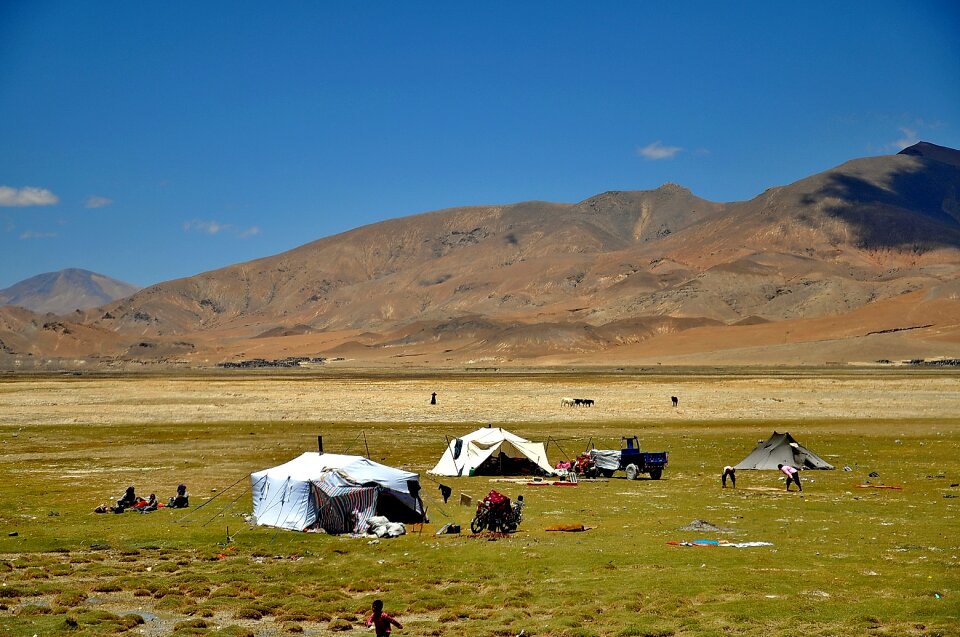 Mountain and grassland on Tibetan Plateau with blue sky