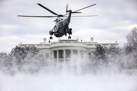 Marine One lands on the snow-covered South Lawn