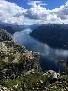 People on rocks harsh Norway, Trolltunga photo