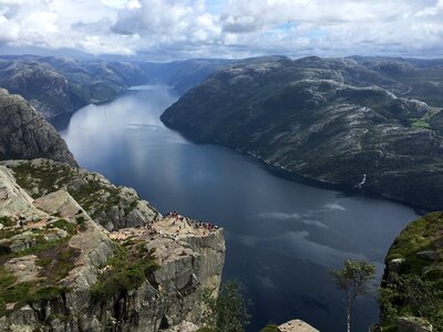 People on rocks harsh Norway, Trolltunga photo