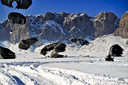 parachute landing extreme snow,mountains photo