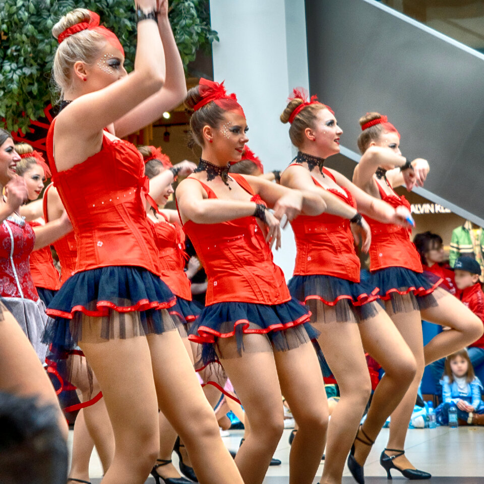 Cheerleader and dancer performing on stage