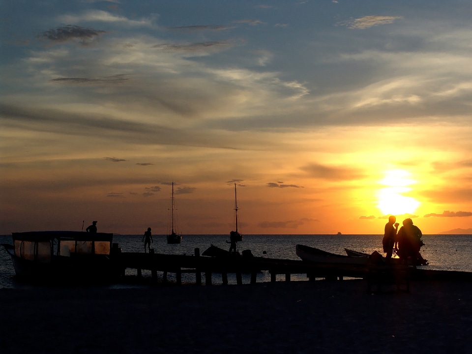 People silhouettes boats