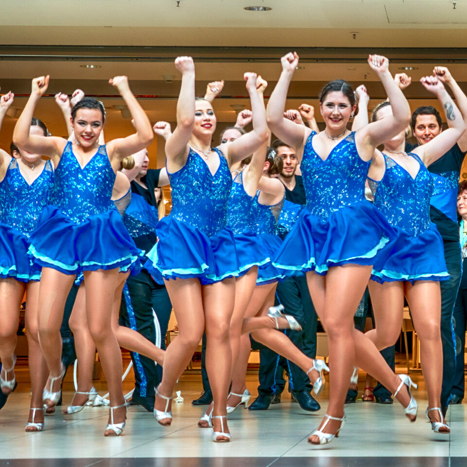 Cheerleader and dancer performing on stage