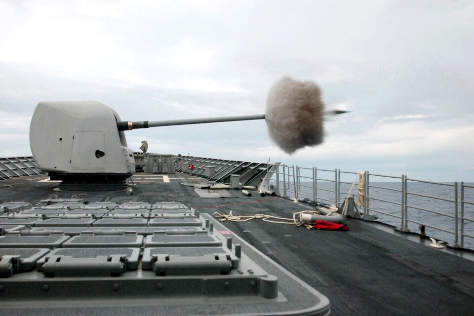 A 54 caliber MK-45 five-inch gun fires