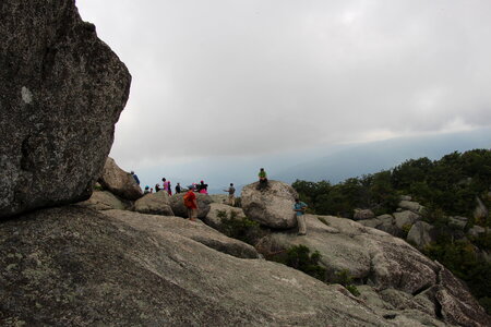 hiker looks over valley in the Shenandoah on a climb of Old Rag