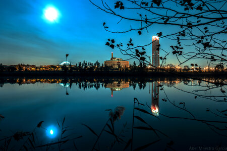 Sunset in the city on the bank of the river