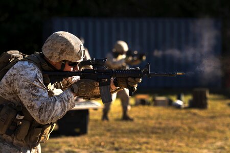 Training Battalion, fires an M-4 Carbine photo