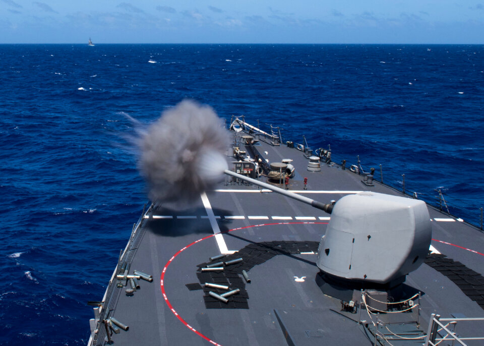 USS Curtis Wilbur fires a mark 45 five-inch gun