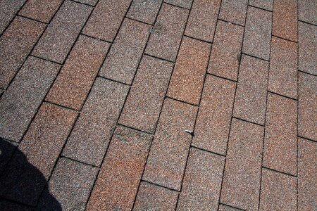 A tiled roof of a building with a wire loop