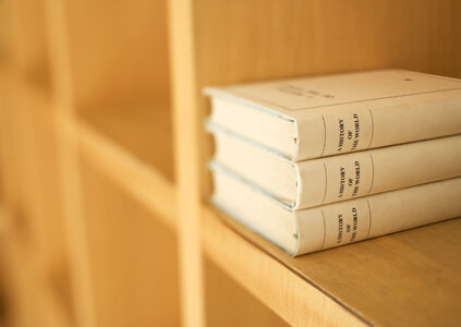Books on a wooden shelfs. photo