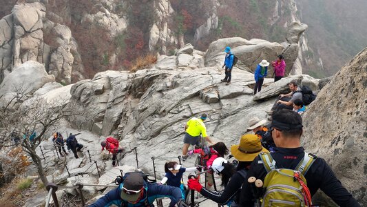 climbers traversing a steep slope seoul,Korea