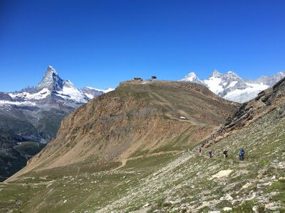 hikers team in the mountains. Matterhorn. Swiss Alps