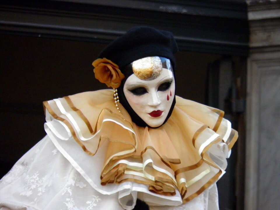 Venetian carnival mask in Venice during Mardi Gras, Italy,