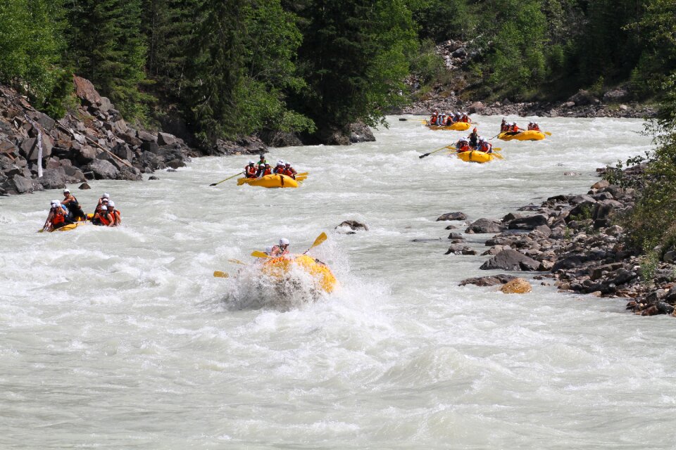Group of adventurers in an inflatable dinghy in the white water