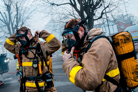 Portrait of two heroic fireman in protective suit photo