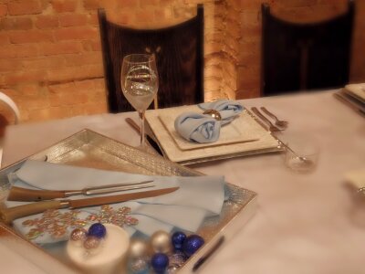 Fine restaurant dinner table place setting: napkin, wineglass, pl photo