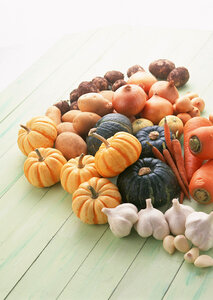 Top view of squash and pumpkins on wooden floor
