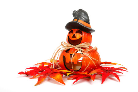 Smiling halloween pumpkin with autumn decoration photo