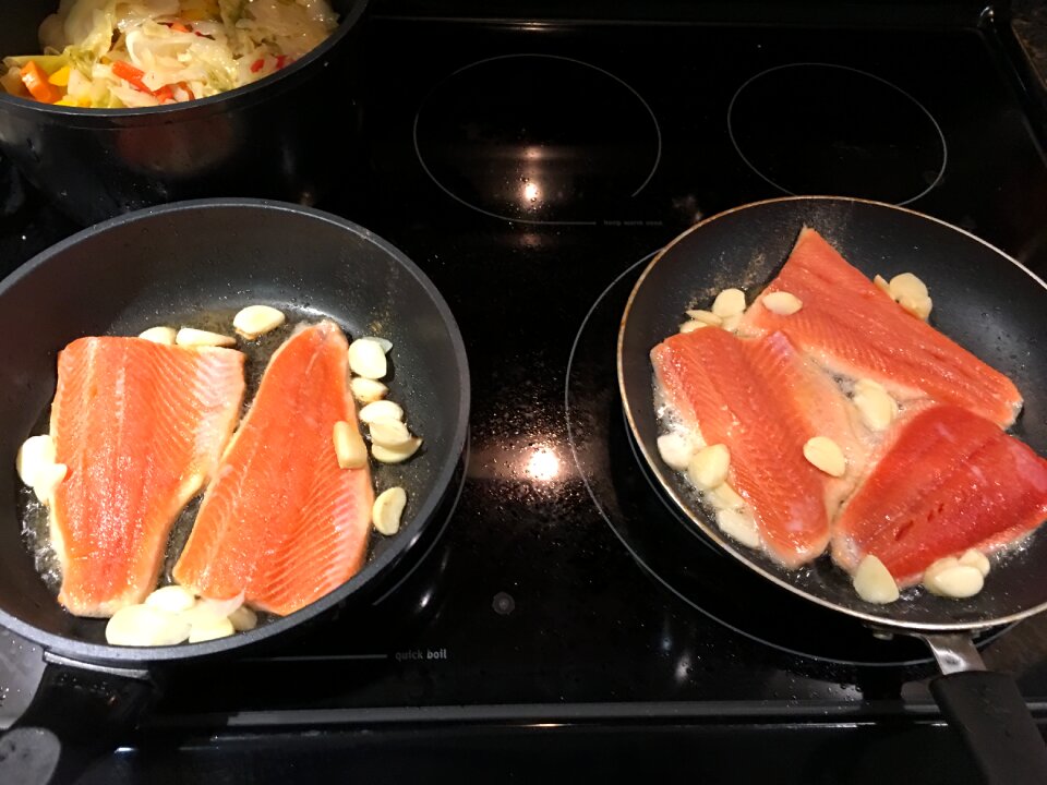 Grilled salmon steak in roasted pan