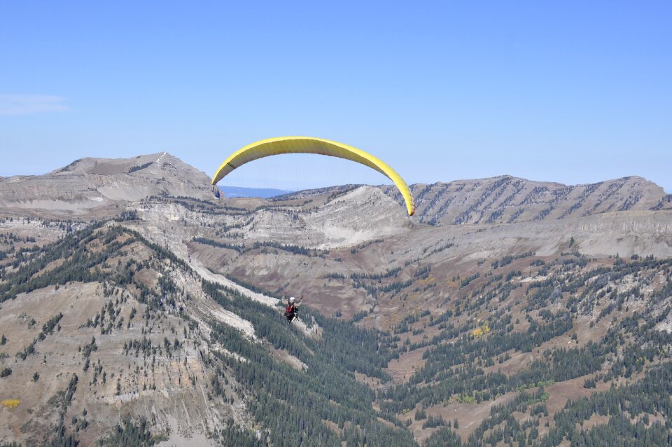 Paraglider prepareing to take off from a mountain