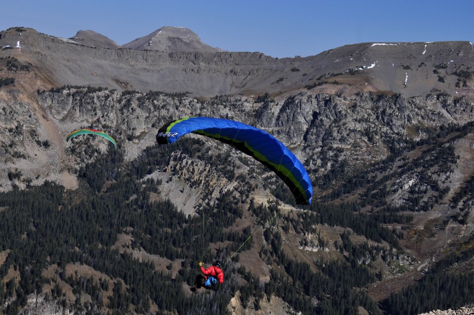Paraglider taking off from a mountain