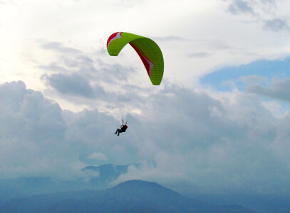 Paraglider, airborne in a clear blue sky