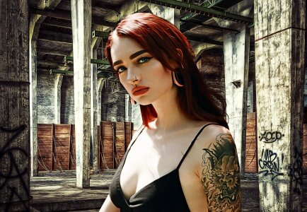 Beautiful tattooed woman with red lipstick photo