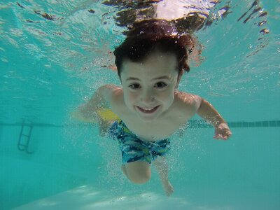 Underwater portrait of happy child. Summer vacation photo