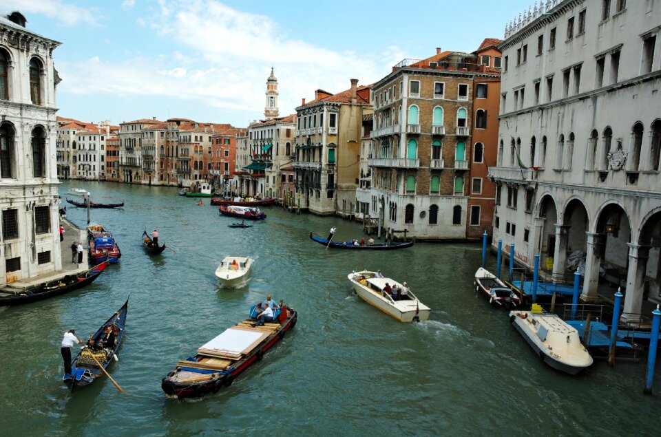 Venice Grand canal with gondolas and Rialto Bridge, Italy