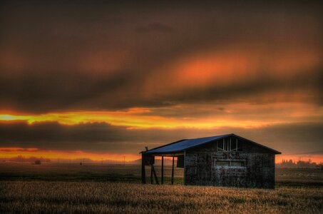 Sunset field and farmhouse inAlberta Canada