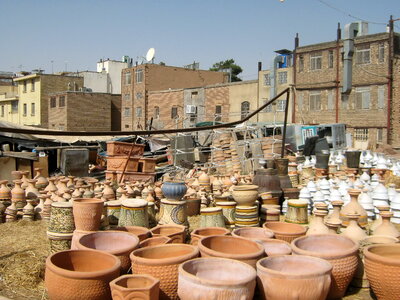 Handmade clay jugs in a pottery workshop photo
