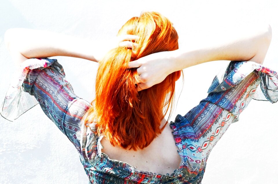 Beautiful Woman Portrait Playing With Her Hair photo