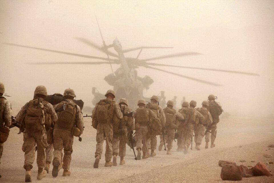 Marine Regiment, load onto a CH-53E Super Stallion helicopter