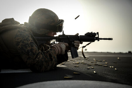 Marine fires his weapon