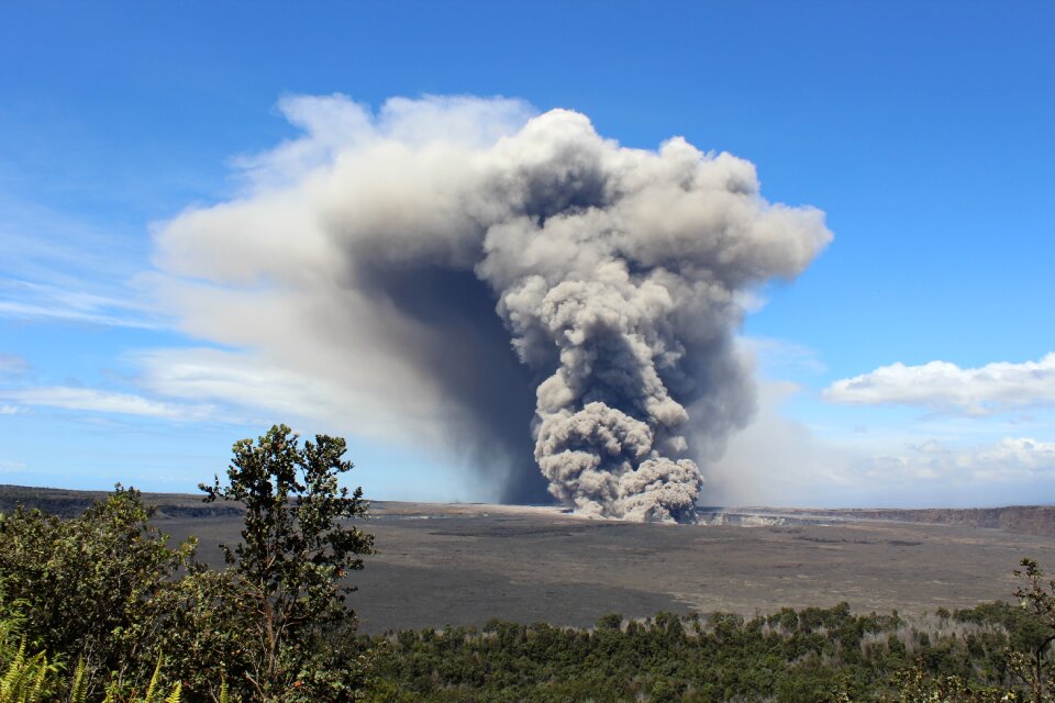A large plume of volcanic ash and debris wafts