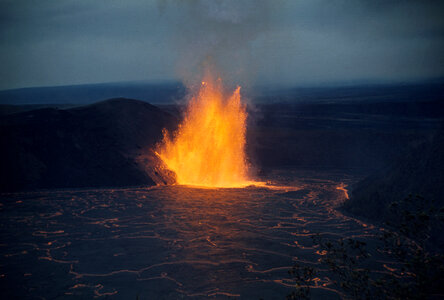 Lava fountain shimmers across lava lake in Kīlauea Iki Crater