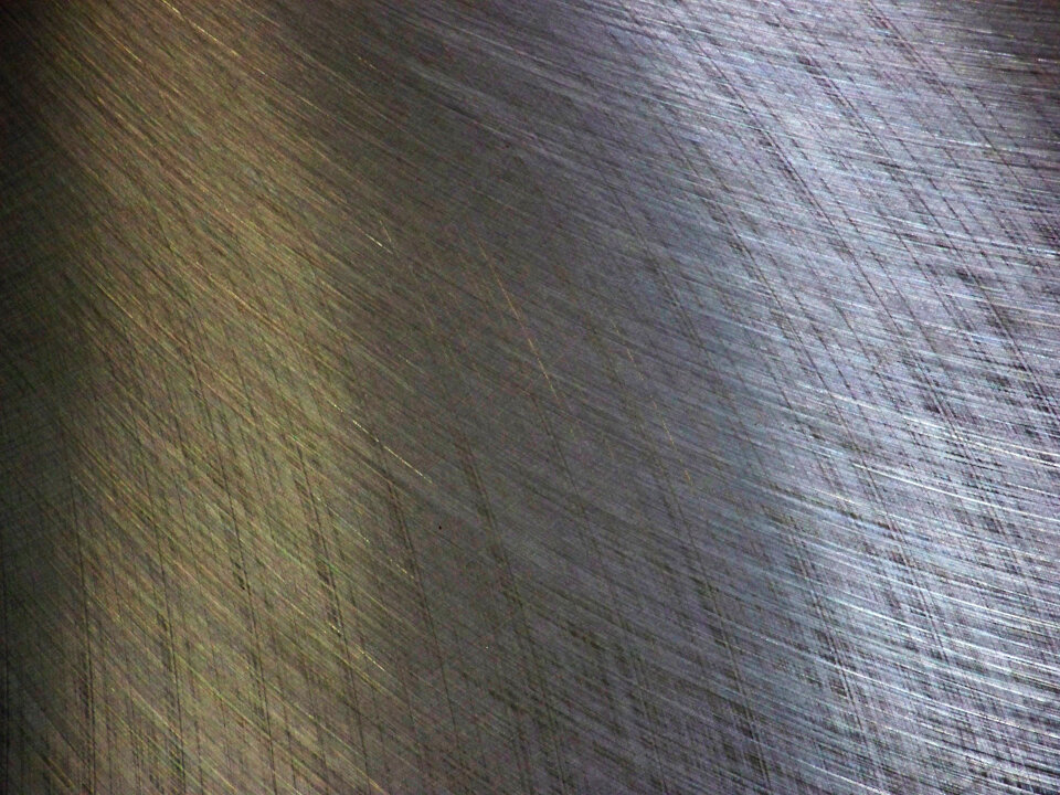 Patterns on a flat steel surface reflect light