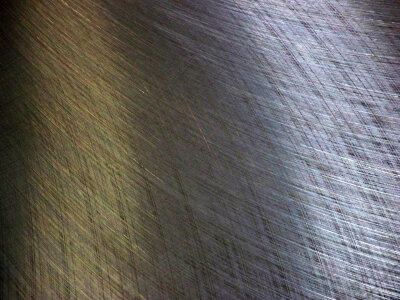 Patterns on a flat steel surface reflect light