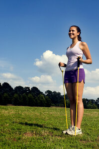 Young Woman Stretching Outdoors Before Exercising photo