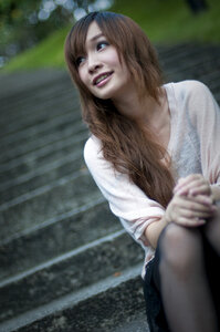 Cute Girl Sitting On Steps Outside