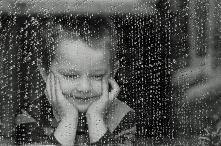 Child and Rain - Black and White photo